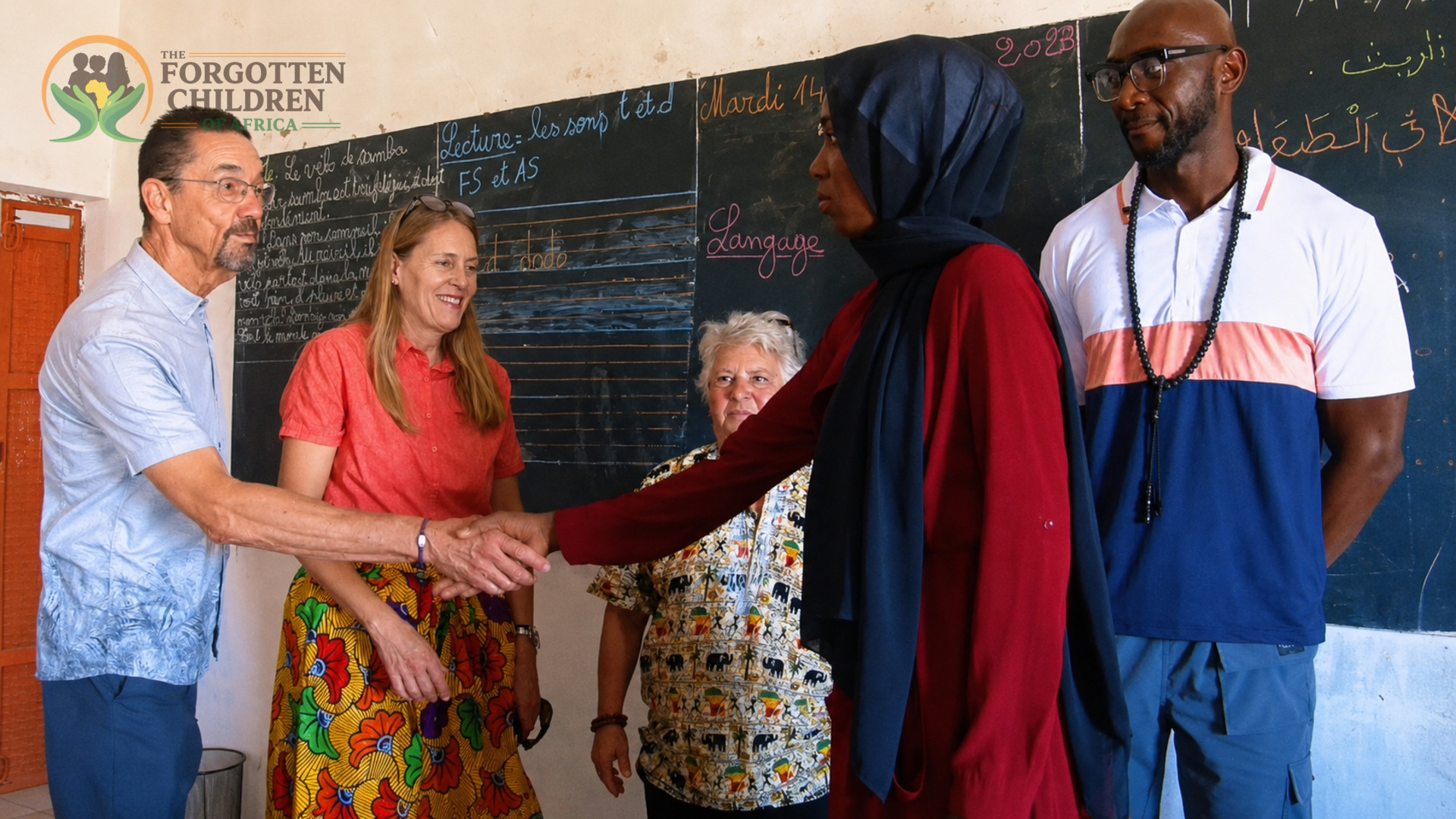 Visitors greeting school staff